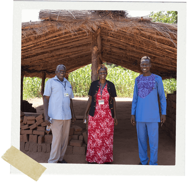 Church leaders in Africa in front of a church