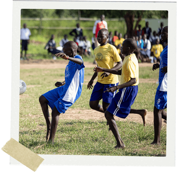 Teenagers playing football
