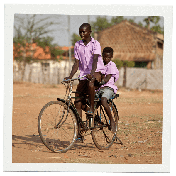 2 Boys riding a bicycle