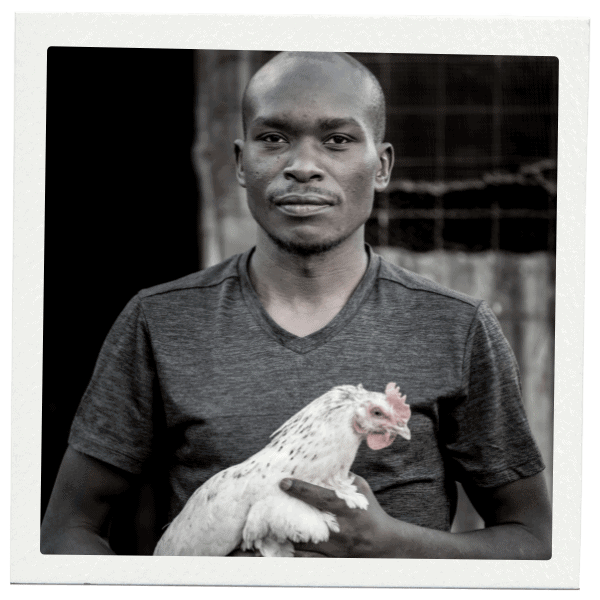 Man holding a chicken