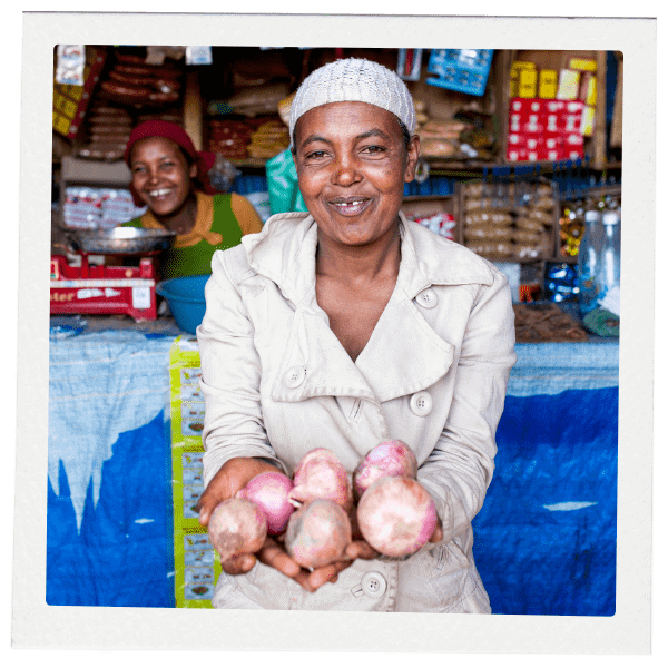 Woman showing onions in her hands
